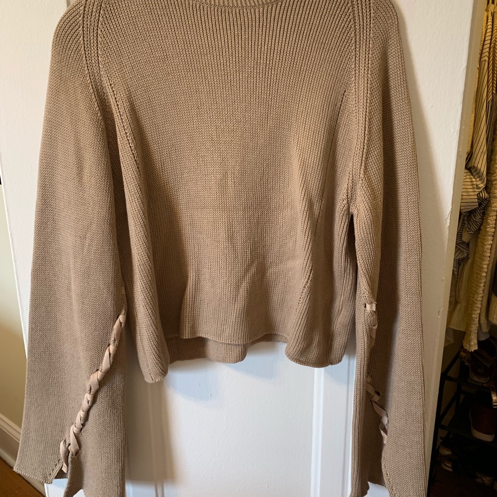Wide armed high necked sweater